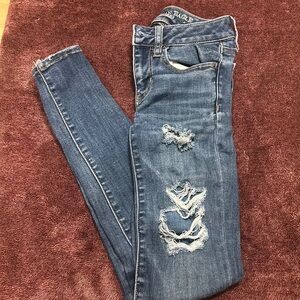 American eagle 00 jegging jeans with holes, pants material underneath of holes